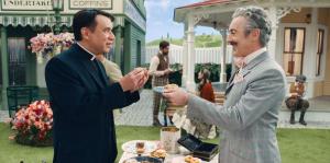 ‘Schmigadoon!’: Mayor Menlove and Reverend Layton Share Special Moment in Apple TV+ Exclusive Clip