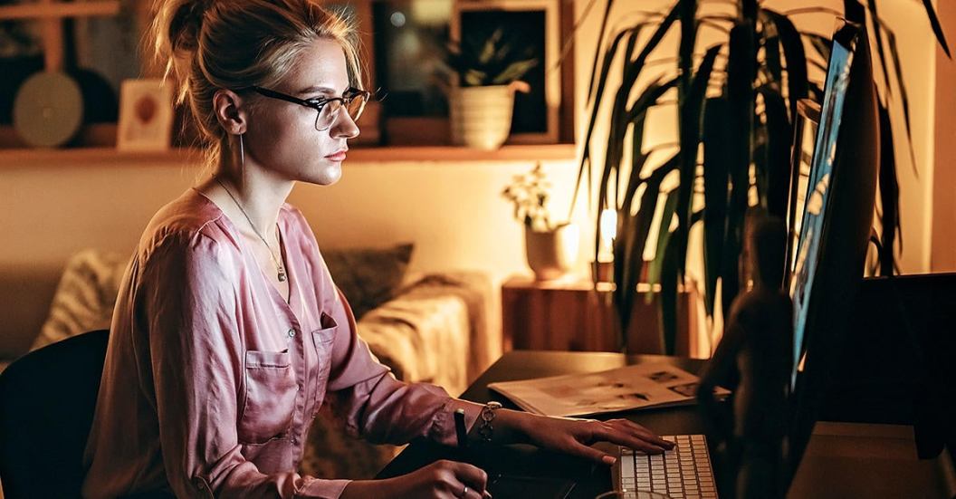Woman at computer, filing taxes online