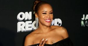 Eve All Smiles in Photo With Newborn Son