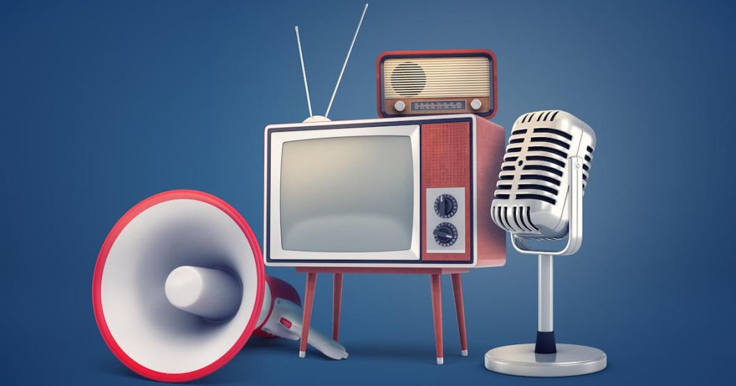 3d rendering of collection of several pieces of vintage equipment: a TV, a radio set, a microphone and a megaphone.