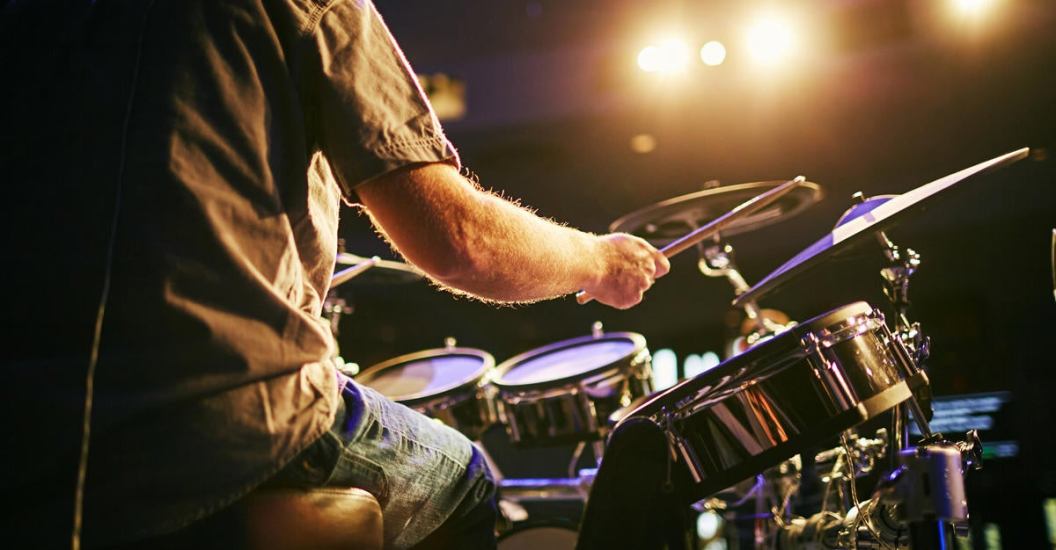 Midsection Of Man Playing Drum