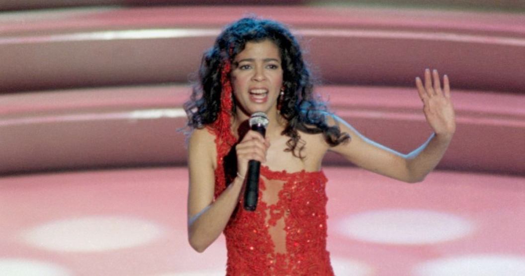 Irene Cara Holding Grammy Award