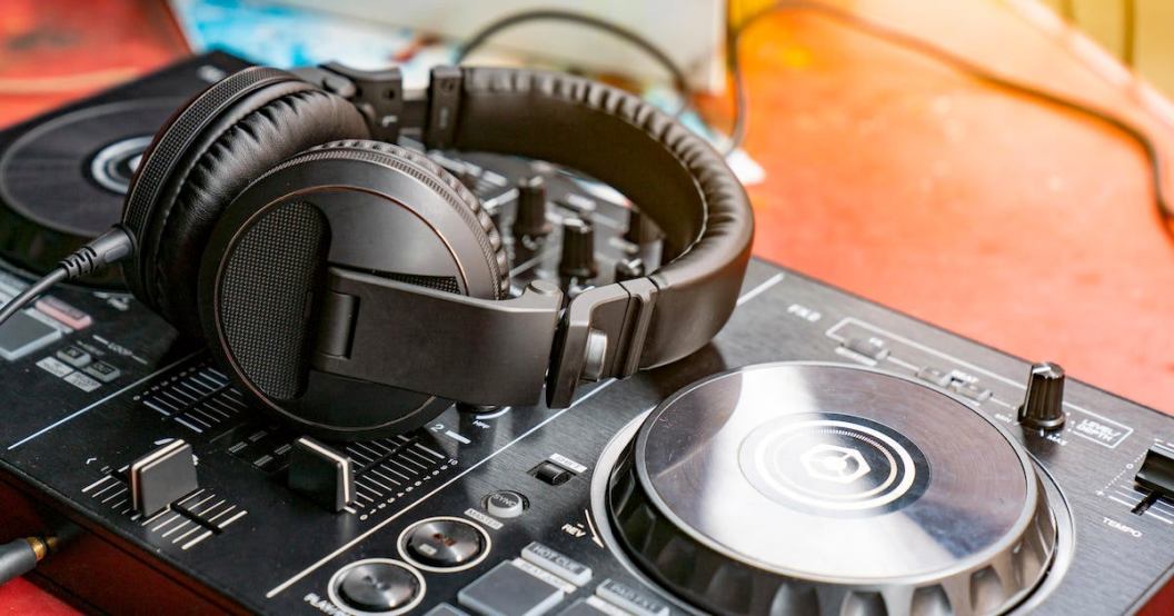 DJ Spinning, Mixing, and Scratching in a Night Club