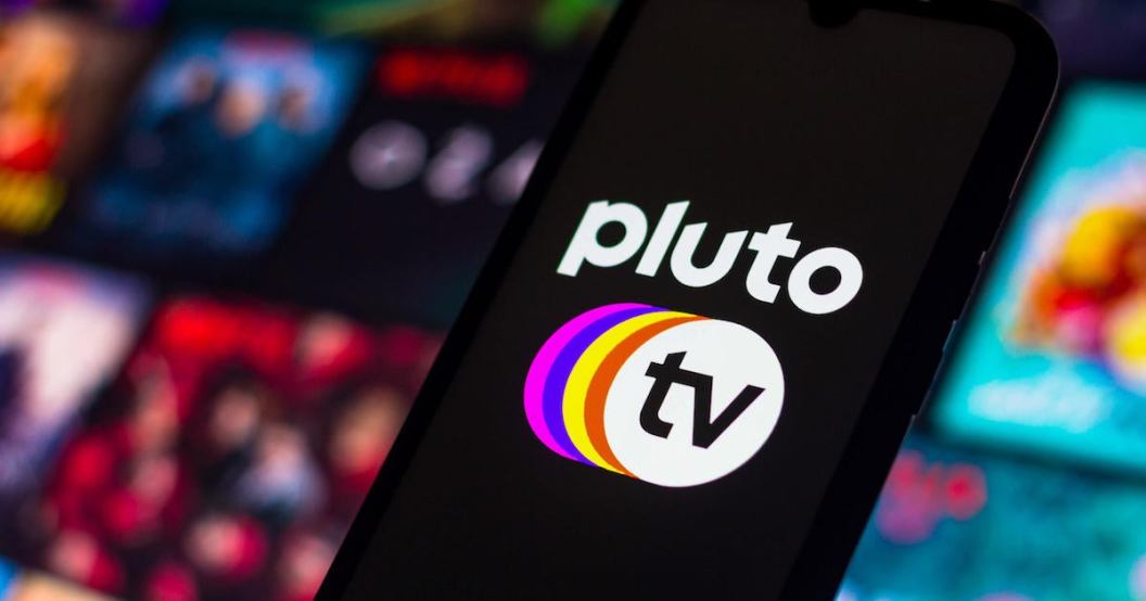 In this photo illustration the Pluto TV logo seen displayed