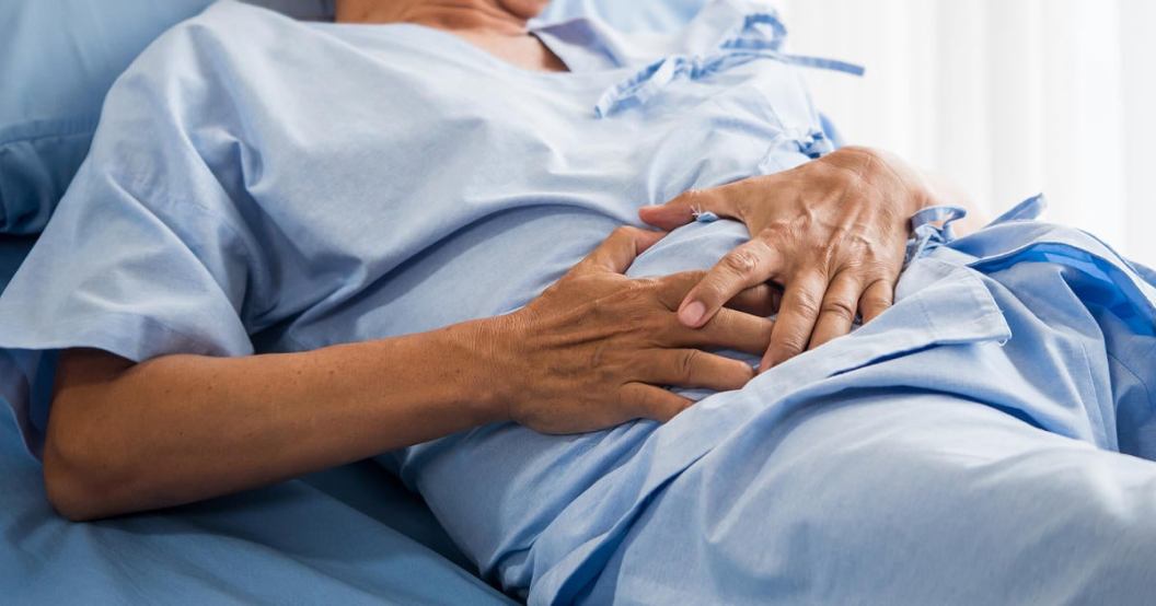patient-with-stomach-ache-on-hospital-bed.jpg