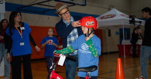 Rob Schneider and Raising Cane’s Deliver Holiday Bikes to Arizona Kids (Exclusive)