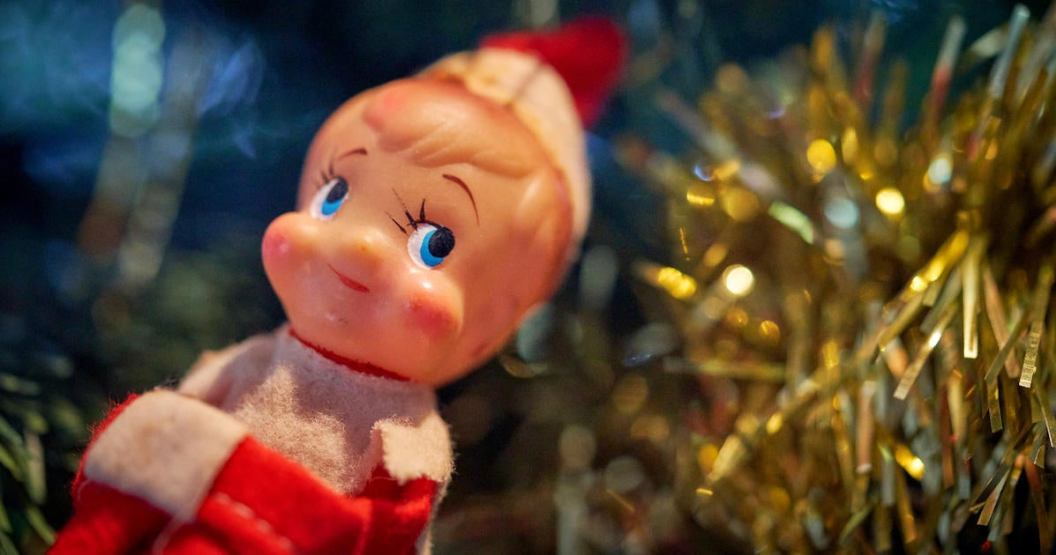 A close-up a Christmas Elf from the 1960's hanging out on a Christmas tree