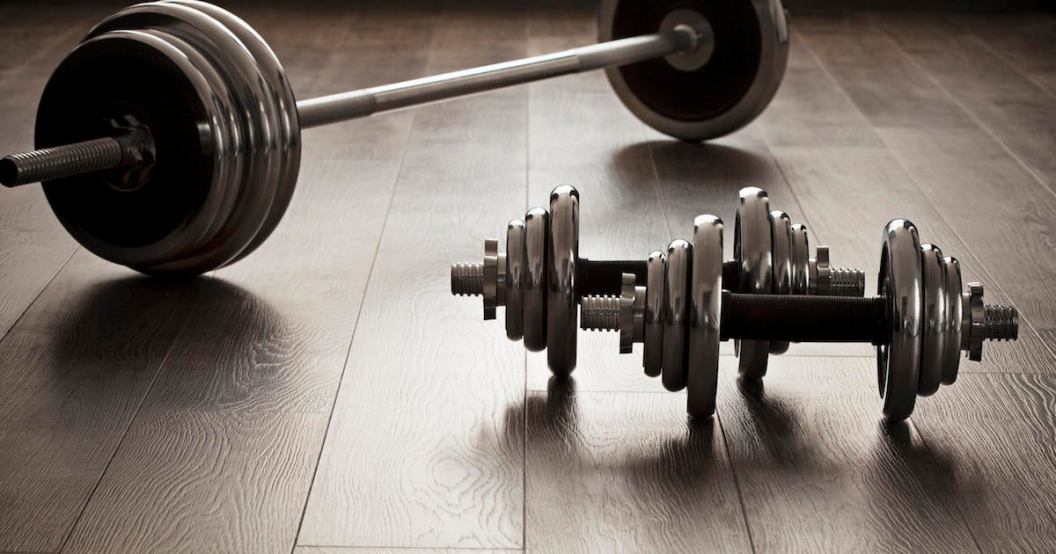dumbells for fitness on wooden floor