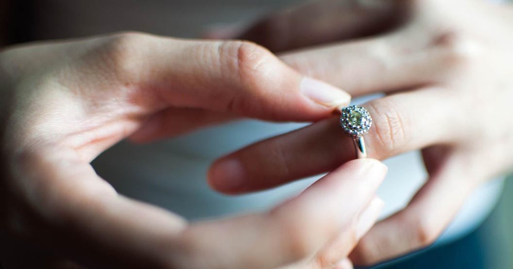 woman-removing-engagement-ring.jpg