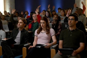 ‘The Irrational’: Simon and Phoebe Share a Moment During Alec’s Lecture in Exclusive Sneak Peek